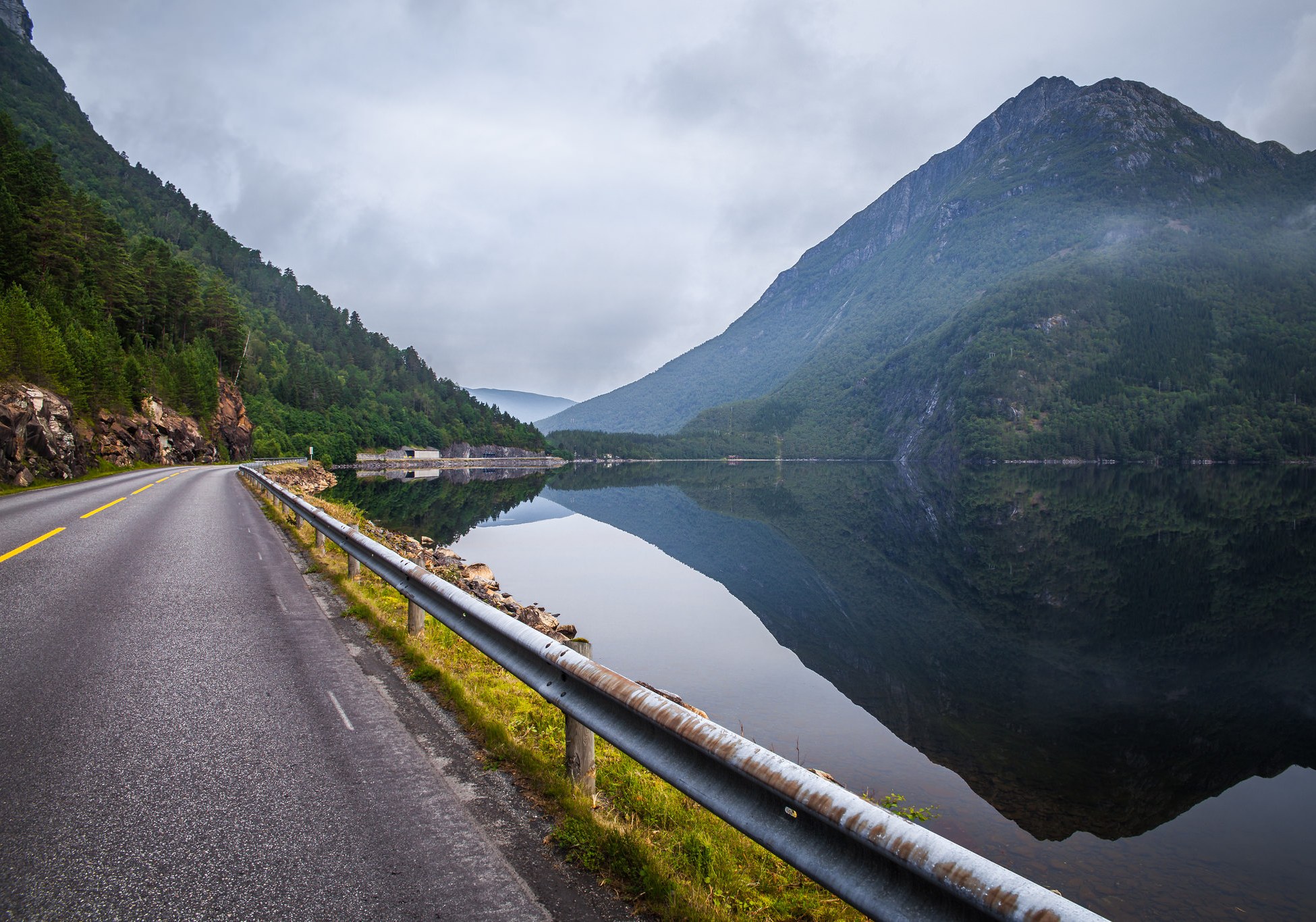Mountain road beside a lake